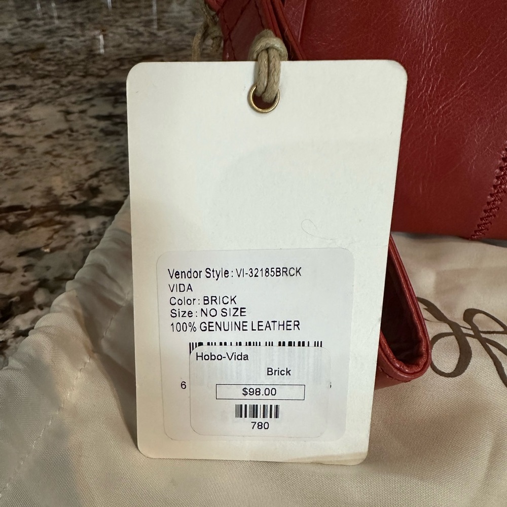 Hobo clutch. Brick color. New with tags. Never used.